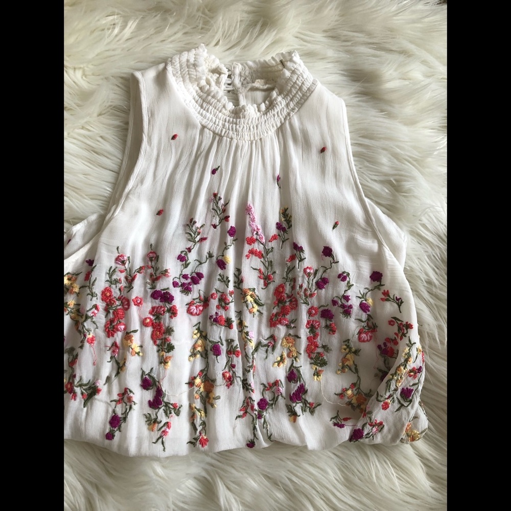 Embroidered mock neck floral anthro top
